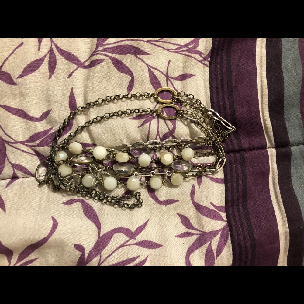 Yellow/gold (not real) necklace with white stone